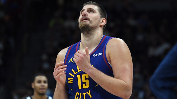 Nov 22, 2025; Denver, Colorado, USA; Denver Nuggets center Nikola Jokic (15) walks back to the bench during a timeout while trailing during the second half against the Sacramento Kings at Ball Arena. Mandatory Credit: Christopher Hanewinckel-Imagn Images