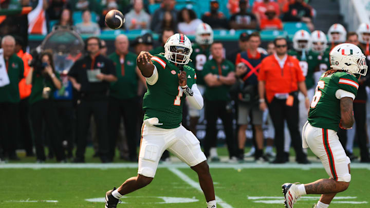 Nov 23, 2024; Miami Gardens, Florida, USA; Miami Hurricanes quarterback Cam Ward (1) throws the football against the Wake Forest Demon Deacons during the first quarter at Hard Rock Stadium. Mandatory Credit: Sam Navarro-Imagn Images