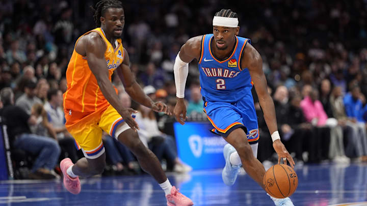 Nov 15, 2025; Charlotte, North Carolina, USA; Oklahoma City Thunder guard Shai Gilgeous-Alexander (2) drives to the basket against Charlotte Hornets guard Sion James (4)during the second half at Spectrum Center. Mandatory Credit: Jim Dedmon-Imagn Images