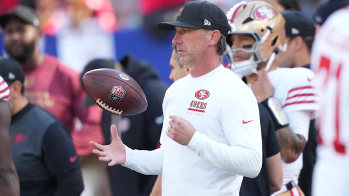 Nov 2, 2025; East Rutherford, New Jersey, USA; San Francisco 49ers head coach Kyle Shanahan tosses a football in the air during warm ups prior to a game against the New York Giants at MetLife Stadium. Mandatory Credit: Robert Deutsch-Imagn Images Nov 2, 2025; East Rutherford, New Jersey, USA; San Francisco 49ers head coach Kyle Shanahan tosses a football in the air during warm ups prior to a game against the New York Giants at MetLife Stadium. Mandatory Credit: Robert Deutsch-Imagn Images