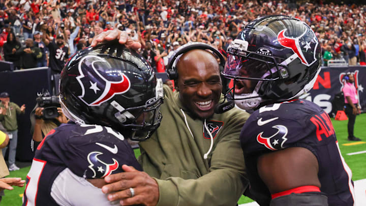 Nov 9, 2025; Houston, Texas, USA; Houston Texans head coach DeMeco Ryans with defensive tackle Sheldon Rankins (90) and linebacker Azeez Al-Shaair (0) following a game against the Jacksonville Jaguars at NRG Stadium. Mandatory Credit: Thomas Shea-Imagn Images