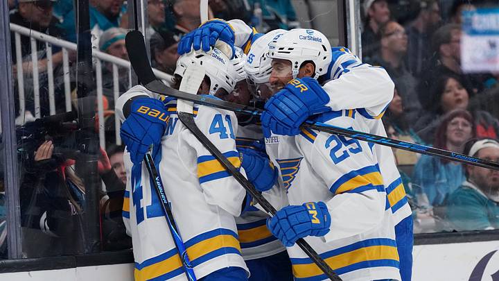 Mar 30, 2026; San Jose, California, USA;  St. Louis Blues defenseman Theo Lindstein (41) celebrates with left winger Jake Neighbours (63), defenseman Colton Parayko (55) and right winger Jordan Kyrou (25) after scoring a goal against the San Jose Sharks in the first period at SAP Center at San Jose. Mandatory Credit: David Gonzales-Imagn Images