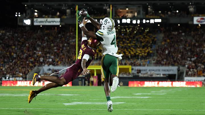 Oct 3, 2026; Tempe, Arizona, USA; Baylor Bears wide receiver Louis Brown IV (4) makes a catch for a touchdown against Arizona State Sun Devils defensive back Rodney Bimage Jr. (0) during the second quarter at Mountain America Stadium. Mandatory Credit: Anna Carrington-Imagn Images