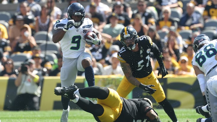 Sep 14, 2025; Pittsburgh, Pennsylvania, USA;  Seattle Seahawks running back Kenneth Walker III (9) leaps over Pittsburgh Steelers defensive tackle Yaha Black (bottom) on a second quarter carry at Acrisure Stadium. Mandatory Credit: Charles LeClaire-Imagn Images