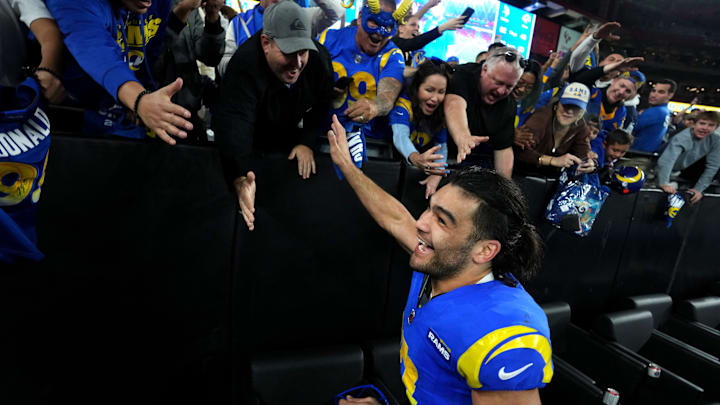 Los Angeles Rams receiver Puka Nacua (17) high-fives fans after their 27-9 playoff win over the Minnesota Vikings at State Farm Stadium on Jan. 13, 2025, in Glendale.