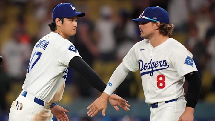 Sep 9, 2025; Los Angeles, California, USA; Los Angeles Dodgers designated hitter Shohei Ohtani (17) and first baseman Kike Hernandez (8) celebrate after the game against the Colorado Rockies at Dodger Stadium. Mandatory Credit: Kirby Lee-Imagn Images