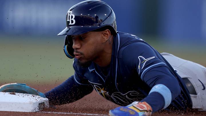 Aug 11, 2026; West Sacramento, California, USA; Tampa Bay Rays left fielder Chandler Simpson (14) slides back to first base in a game against the Athletics during the first inning at Sutter Health Park. Mandatory Credit: Dennis Lee-Imagn Images
