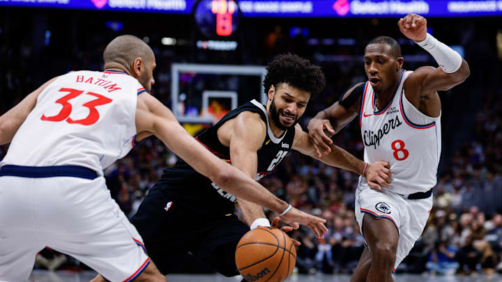 Jan 30, 2026; Denver, Colorado, USA; Denver Nuggets guard Jamal Murray (27) battles for the ball with Los Angeles Clippers forward Nicolas Batum (33) and guard Kris Dunn (8) in the third quarter at Ball Arena. Mandatory Credit: Isaiah J. Downing-Imagn Images Jan 30, 2026; Denver, Colorado, USA; Denver Nuggets guard Jamal Murray (27) battles for the ball with Los Angeles Clippers forward Nicolas Batum (33) and guard Kris Dunn (8) in the third quarter at Ball Arena. Mandatory Credit: Isaiah J. Downing-Imagn Images