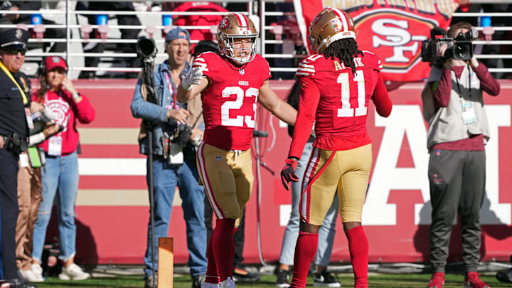 Nov 19, 2023; Santa Clara, California, USA; San Francisco 49ers running back Christian McCaffrey (23) celebrates with wide receiver Brandon Aiyuk (11) after scoring a touchdown against the Tampa Bay Buccaneers during the first quarter at Levi's Stadium. Mandatory Credit: Darren Yamashita-Imagn Images