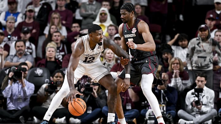 Texas A&M Aggies forward Rashaun Agee (12) controls the ball as Oklahoma Sooners forward Mohamed Wague (5) defends during the second half at Reed Arena. Mandatory Credit: Maria Lysaker-Imagn Images 
