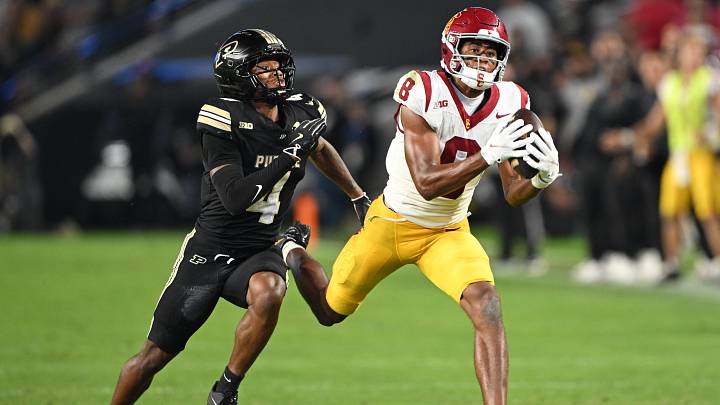 Sep 13, 2025; West Lafayette, Indiana, USA; USC Trojans wide receiver Ja'Kobi Lane (8) catches a pass in front of Purdue Boilermakers defensive back Hudauri Hines (4) during the second half at Ross-Ade Stadium. Mandatory Credit: Marc Lebryk-Imagn Images Sep 13, 2025; West Lafayette, Indiana, USA; USC Trojans wide receiver Ja'Kobi Lane (8) catches a pass in front of Purdue Boilermakers defensive back Hudauri Hines (4) during the second half at Ross-Ade Stadium. Mandatory Credit: Marc Lebryk-Imagn Images