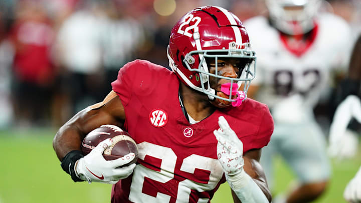 Sep 28, 2024; Tuscaloosa, Alabama, USA;  Alabama Crimson Tide running back Justice Haynes (22) runs the ball against the Georgia Bulldogs during the fourth quarter at Bryant-Denny Stadium. Mandatory Credit: John David Mercer-Imagn Images