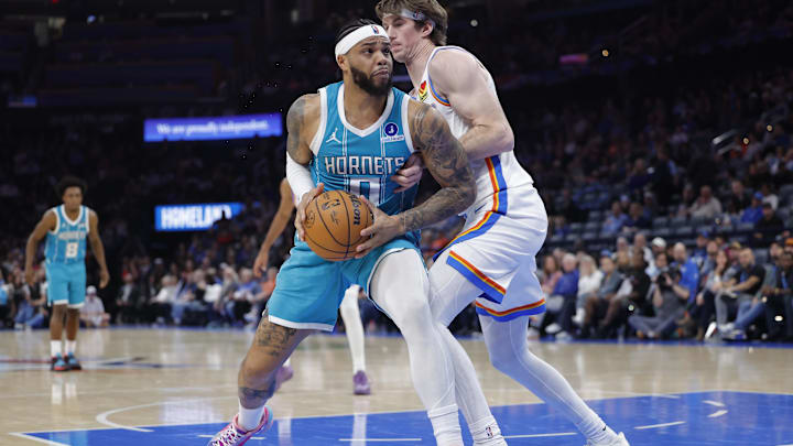 Jan 5, 2026; Oklahoma City, Oklahoma, USA; Charlotte Hornets forward Miles Bridges (0) drives to the basket against Oklahoma City Thunder center Branden Carlson (15) during the second half at Paycom Center. Mandatory Credit: Alonzo Adams-Imagn Images