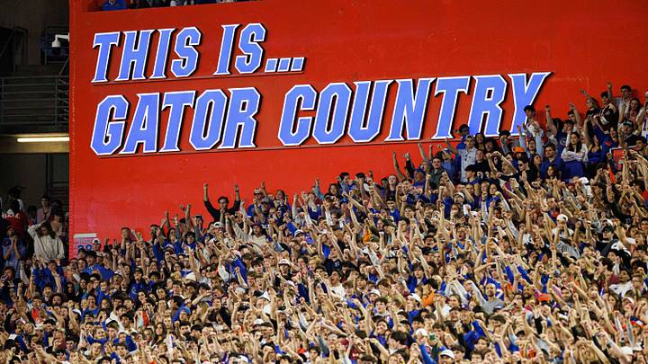 A sign that reads This Is Gator Country is illuminated while fans cheer between the Florida Gators and Florida State Seminoles A sign that reads This Is Gator Country is illuminated while fans cheer between the Florida Gators and Florida State Seminoles