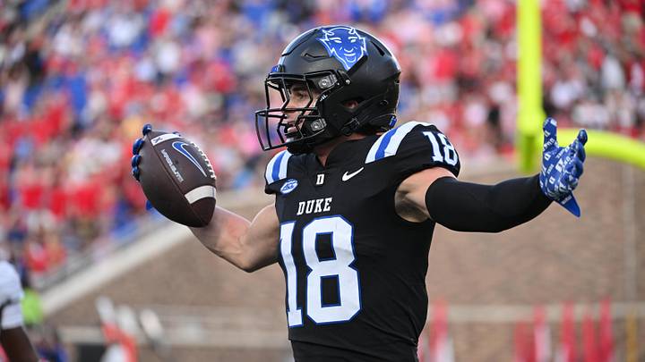 Sep 20, 2025; Durham, North Carolina, USA;  Duke Blue Devils wide receiver Cooper Barkate (18) celebrates a touchdown during the third quarter against the NC State Wolfpack at Wallace Wade Stadium. Mandatory Credit: Zachary Taft-Imagn Images