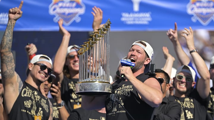 Nov 1, 2024; Los Angeles, CA, USA; starting pitcher Clayton Kershaw (22) lifts the World Series Championship Trophy during the team celebration at Dodger Stadium. Mandatory Credit: Jayne Kamin-Oncea-Imagn Images Nov 1, 2024; Los Angeles, CA, USA; starting pitcher Clayton Kershaw (22) lifts the World Series Championship Trophy during the team celebration at Dodger Stadium. Mandatory Credit: Jayne Kamin-Oncea-Imagn Images