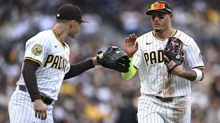 Sep 18, 2024; San Diego, California, USA; San Diego Padres third baseman Manny Machado (right) is greeted by starting pitcher Dylan Cease (left) after a defensive play against the Houston Astros during the third inning at Petco Park. Mandatory Credit: Orlando Ramirez-Imagn Images Sep 18, 2024; San Diego, California, USA; San Diego Padres third baseman Manny Machado (right) is greeted by starting pitcher Dylan Cease (left) after a defensive play against the Houston Astros during the third inning at Petco Park. Mandatory Credit: Orlando Ramirez-Imagn Images