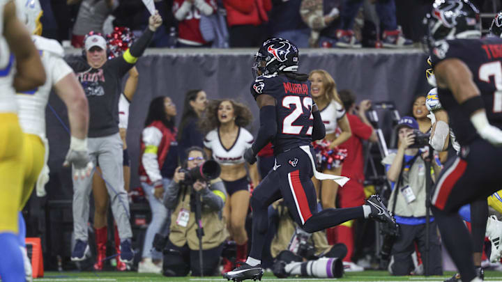 Jan 11, 2025; Houston, Texas, USA; Houston Texans safety Eric Murray (23) returns an interception for a touchdown during the game against the Los Angeles Chargers in an AFC wild card game at NRG Stadium. Mandatory Credit: Troy Taormina-Imagn Images Jan 11, 2025; Houston, Texas, USA; Houston Texans safety Eric Murray (23) returns an interception for a touchdown during the game against the Los Angeles Chargers in an AFC wild card game at NRG Stadium. Mandatory Credit: Troy Taormina-Imagn Images
