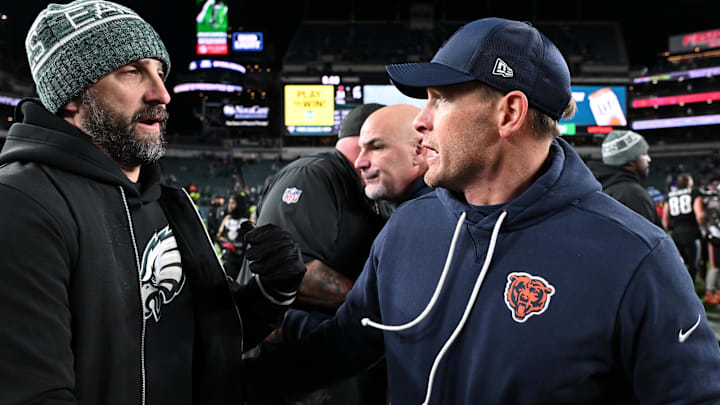 Ben Johnson is congratulated by Eagles coach Nick Sirianni before he gave up his shirt in the locker room.