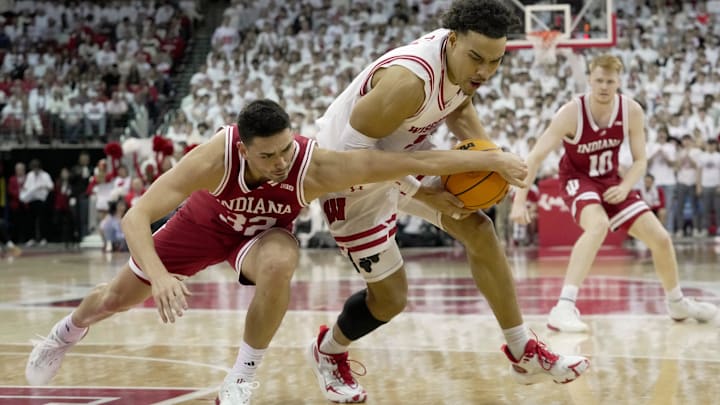 Wisconsin guard John Tonje gets to a loose ball ahead of Indiana guard Trey Galloway during the first half Tuesday night at the Kohl Center in Madison.