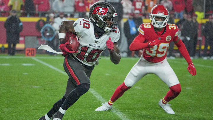 Nov 4, 2024; Kansas City, Missouri, USA; Tampa Bay Buccaneers wide receiver Trey Palmer (10) runs the ball as Kansas City Chiefs cornerback Keith Taylor Jr. (39) defends during the game at GEHA Field at Arrowhead Stadium. Mandatory Credit: Denny Medley-Imagn Images