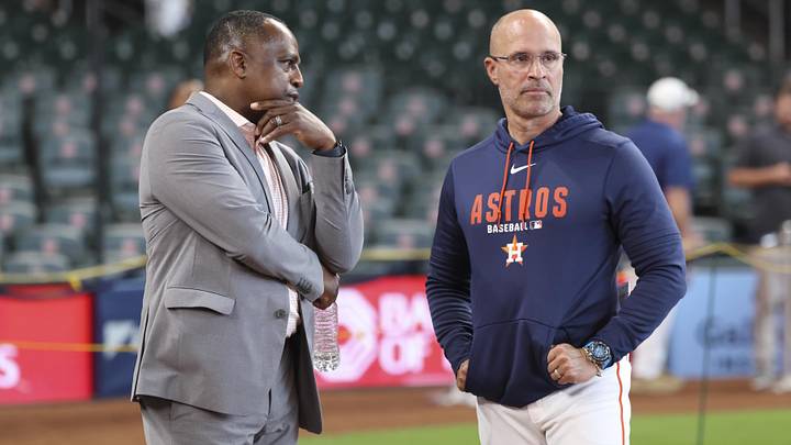 Houston Astros general manager Dana Brown (left) talks with manager Joe Espada. Houston Astros general manager Dana Brown (left) talks with manager Joe Espada.