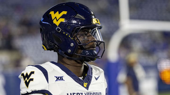 Oct 3, 2025; Provo, Utah, USA; West Virginia Mountaineers quarterback Khalil Wilkins (14) looks on before the game against the Brigham Young Cougars at LaVell Edwards Stadium. Mandatory Credit: Rob Gray-Imagn Images