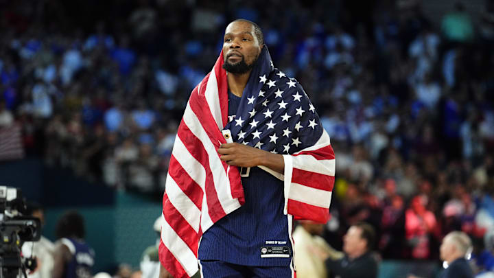 Aug 10, 2024; Paris, France; United States guard Kevin Durant (7) celebrates after defeating France in the men's basketball gold medal game during the Paris 2024 Olympic Summer Games at Accor Arena. Mandatory Credit: Rob Schumacher-Imagn Images