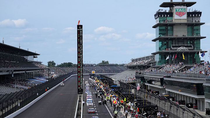 Cars leave pit road prior to the start of the Pennzoil 250, Saturday, July 20, 2024, at Indianapolis Motor Speedway.