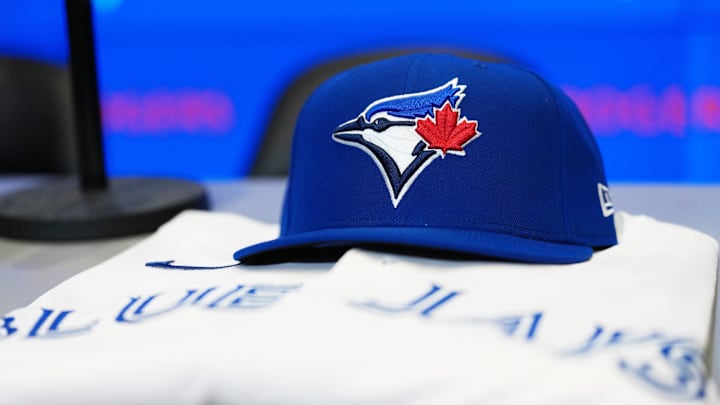The baseball cap and jersey sit on the table before the press conference of Toronto Blue Jays Kazuma Okamoto (not pictured) at Rogers Centre.