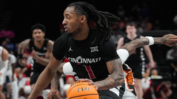 Bearcats Day Day Thomas (1) heads for the hoop during Game 1 of the 2025 Phillips 66 Big 12 Basketball Championship against the Oklahoma State Cowboys at the T-Mobile Center in Kansas City, Missouri on Tuesday March 11, 2025. Bearcats lead the game at halftime with a score of 38-26.