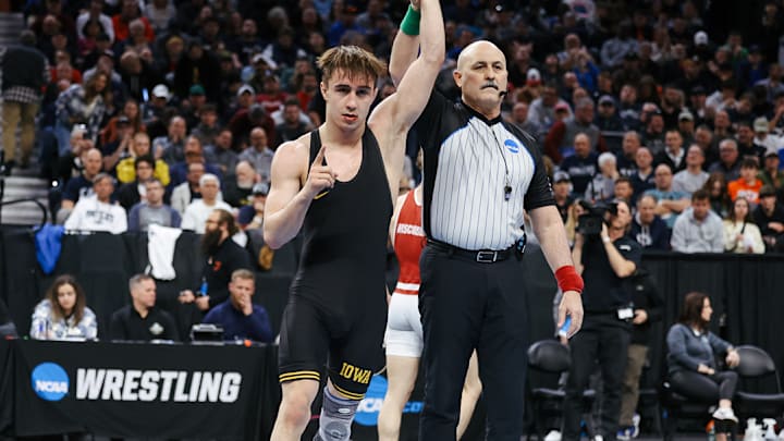 Iowa's Drake Ayala secured a return spot to the NCAA Wrestling Championships Friday night. Ayala is a three-time state champion for Fort Dodge Senior High.