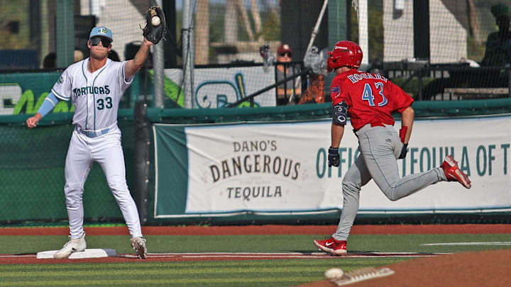 Daytona Tortuga’s first baseman Drew Davies (33) catches the ball and gets Clearwater Thresher’s Jonathan Hogart (43) out at first, Sunday, Aug. 31, 2025 at Jackie Robinson Ballpark in Daytona Beach.