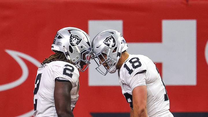 Dec 21, 2025; Houston, Texas, USA; Las Vegas Raiders wide receiver Jack Bech (18) celebrates running back Ashton Jeanty (2) touchdown reception against the Houston Texans in the second half at NRG Stadium. Mandatory Credit: Thomas Shea-Imagn Images