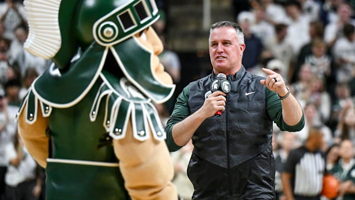 Michigan State's new football coach Pat Fitzgerald addresses the crowd during a timeout in the first half of the Spartans basketball game against Iowa on Tuesday, Dec. 2, 2025, at the Breslin Center in East Lansing.