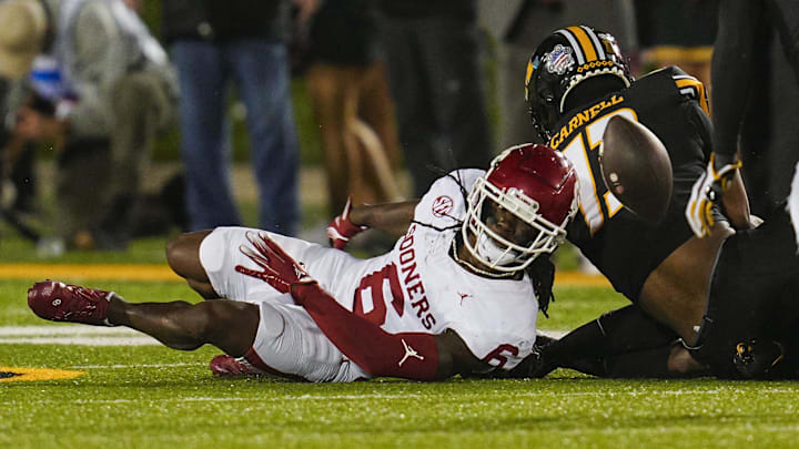 Nov 9, 2024; Columbia, Missouri, USA; Oklahoma Sooners wide receiver Deion Burks (6) fumbles the ball during the second half against the Missouri Tigers at Faurot Field at Memorial Stadium. Mandatory Credit: Jay Biggerstaff-Imagn Images