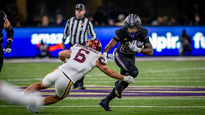 Trey Cooley looks for running room against Minnesota. 