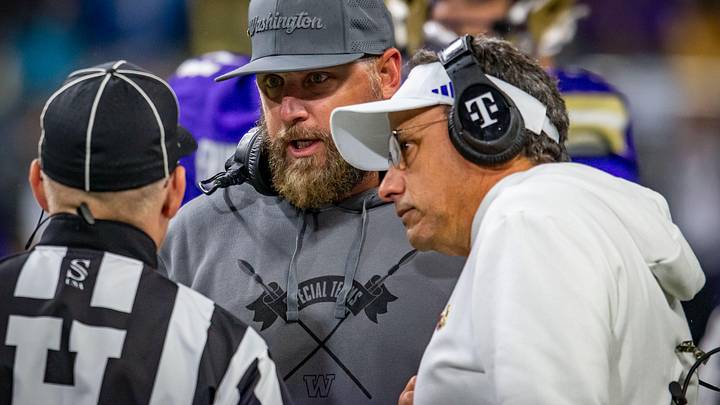 Jedd Fisch and assistant Chris Petrilli question an official. Jedd Fisch and assistant Chris Petrilli question an official.