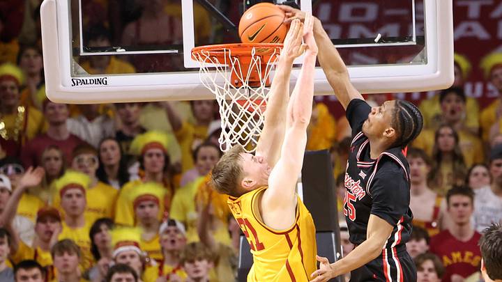 Feb 16, 2026; Ames, Iowa, USA; Houston Cougars guard Mercy Miller (25) dunks over Iowa State Cyclones forward Dominykas Pleta (21) during the first half at James H. Hilton Coliseum.