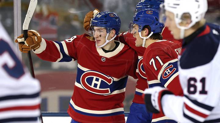 Montreal Canadiens defenseman Lane Hutson (48) celebrates a goal against the Winnipeg Jets in the second period during the 2026 Heritage Classic ice hockey game at Princess Auto Stadium.  Mandatory Credit: James Carey Lauder-Imagn Images