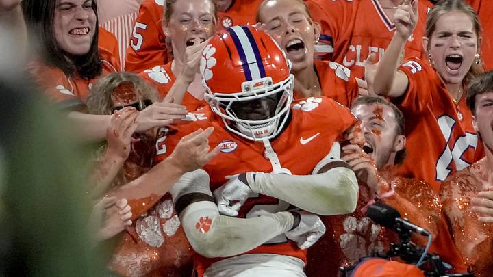 Clemson corner back Ashton Hampton jumps in the student section after making a big play against Georgia Southern at Memorial Stadium 