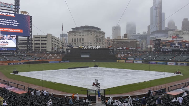 Sep 28, 2024; Detroit, Michigan, USA; The tarp covers the diamond Saturday during a rain delay prior to the game between the Detroit Tigers and the Chicago White Sox at Comerica Park. Mandatory Credit: Brian Bradshaw Sevald-Imagn Images