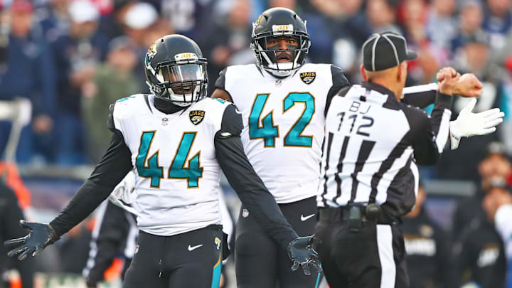 Jan 21, 2018; Foxborough, MA, USA; Jacksonville Jaguars linebacker Myles Jack (44) and safety Barry Church (42) react to a unnecessary roughness penalty against the New England Patriots in the AFC Championship Game at Gillette Stadium. Mandatory Credit: Mark J. Rebilas-Imagn Images