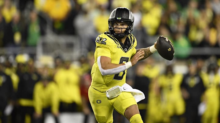 Oct 4, 2024; Eugene, Oregon, USA; Oregon Ducks quarterback Dillon Gabriel (8) throws a touchdown pass during the second half against the Michigan State Spartans at Autzen Stadium. Mandatory Credit: Troy Wayrynen-Imagn Images