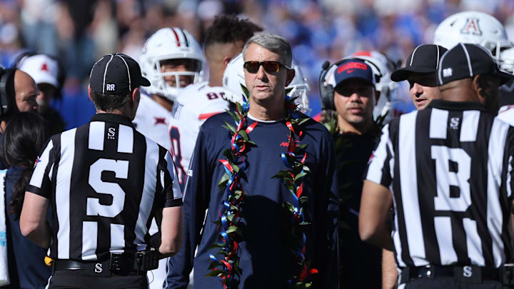 Oct 12, 2024; Provo, Utah, USA; Arizona Wildcats head coach Brent Brennan speaks with officials during the second quarter of the game against the Brigham Young Cougars at LaVell Edwards Stadium. Mandatory Credit: Rob Gray-Imagn Images