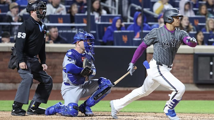 May 24, 2025; New York City, New York, USA; New York Mets right fielder Juan Soto (22) hits a two run double in the fourth inning against the Los Angeles Dodgers at Citi Field. Mandatory Credit: Wendell Cruz-Imagn Images