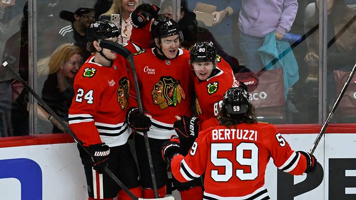 Oct 10, 2026; Chicago, Illinois, USA;  Chicago Blackhawks right wing Roman Kantserov (80), right,  celebrates with  teammmates  after scoring a goal against the  Carolina Hurricanes  during the second period at the United Center.  Mandatory Credit: Matt Marton-Imagn Images