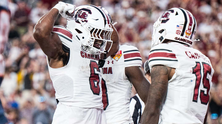 Dec 31, 2024; Orlando, FL, USA; South Carolina Gamecocks running back Dylan Stewart (6) celebrates his touchdown against the Illinois Fighting Illini in the fourth quarter at Camping World Stadium. Mandatory Credit: Jeremy Reper-Imagn Images