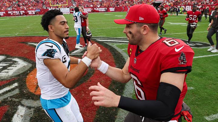 Dec 29, 2024; Tampa, Florida, USA; Tampa Bay Buccaneers quarterback Baker Mayfield (6) great Carolina Panthers quarterback Bryce Young (9) after a game at Raymond James Stadium. Mandatory Credit: Nathan Ray Seebeck-Imagn Images Dec 29, 2024; Tampa, Florida, USA; Tampa Bay Buccaneers quarterback Baker Mayfield (6) great Carolina Panthers quarterback Bryce Young (9) after a game at Raymond James Stadium. Mandatory Credit: Nathan Ray Seebeck-Imagn Images