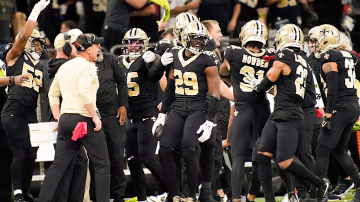 New Orleans Saints cornerback Paulson Adebo (29) celebrates intercepting a Titans pass in the third
